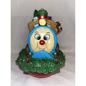 AMC NY Christmas Musical Decoration Ball Train carrying toys atop a red ball